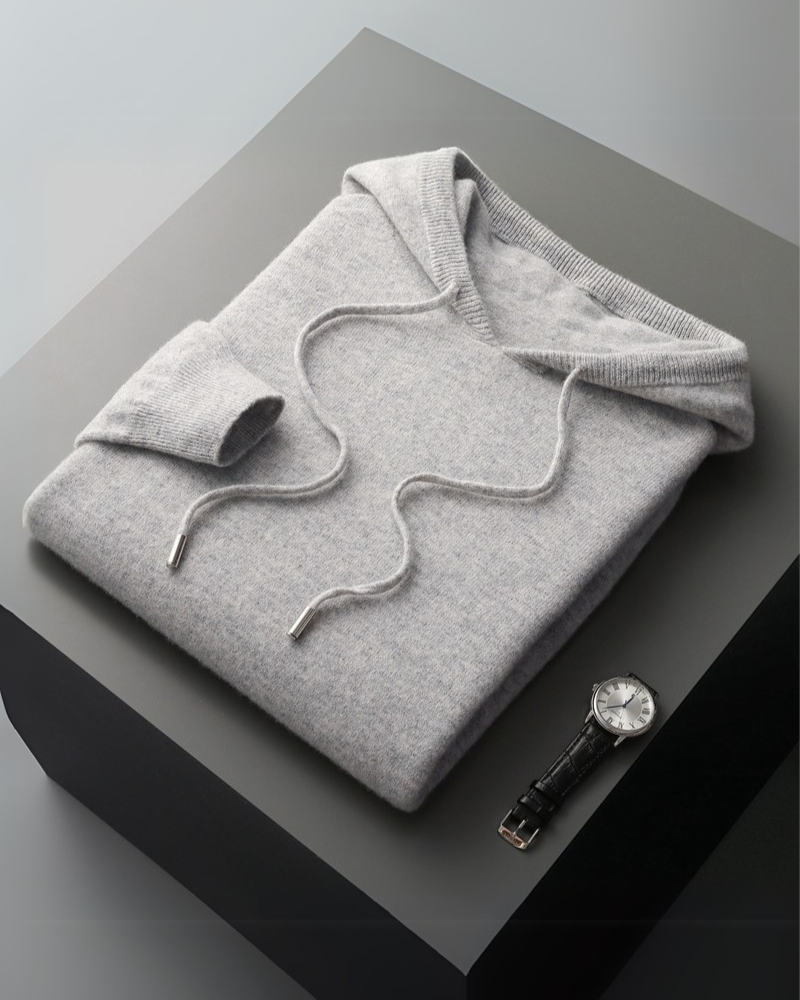 Man wearing 100% cashmere hoodie in Gray – Positano, relaxed fit, soft knit detail.