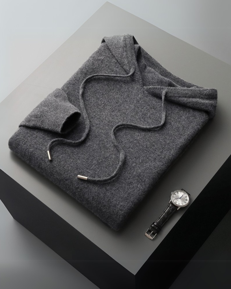 Model in 100% cashmere hoodie in Dark Gray – Positano, close-up of premium cashmere weave.