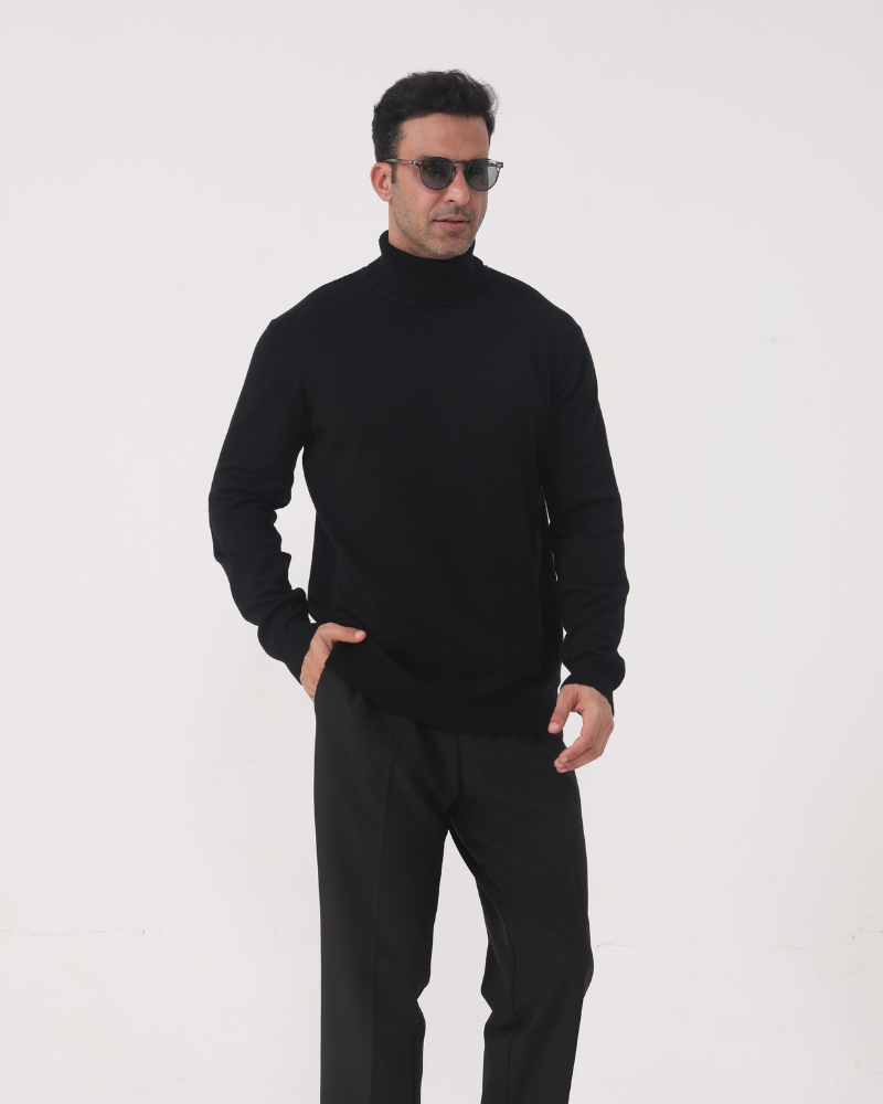 Man wearing merino wool turtleneck sweater in Black – Sorrento, front view, refined tailored fit.