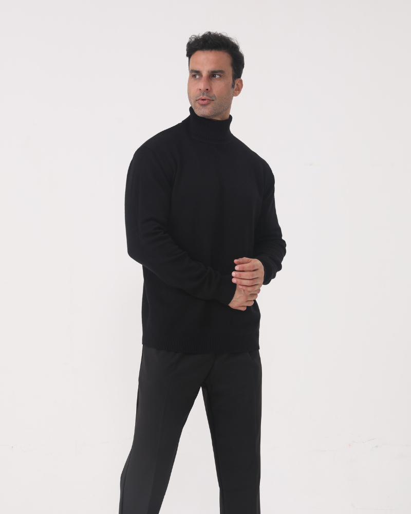 Man wearing merino wool turtleneck sweater in Black – Sorrento, front view, refined tailored fit.